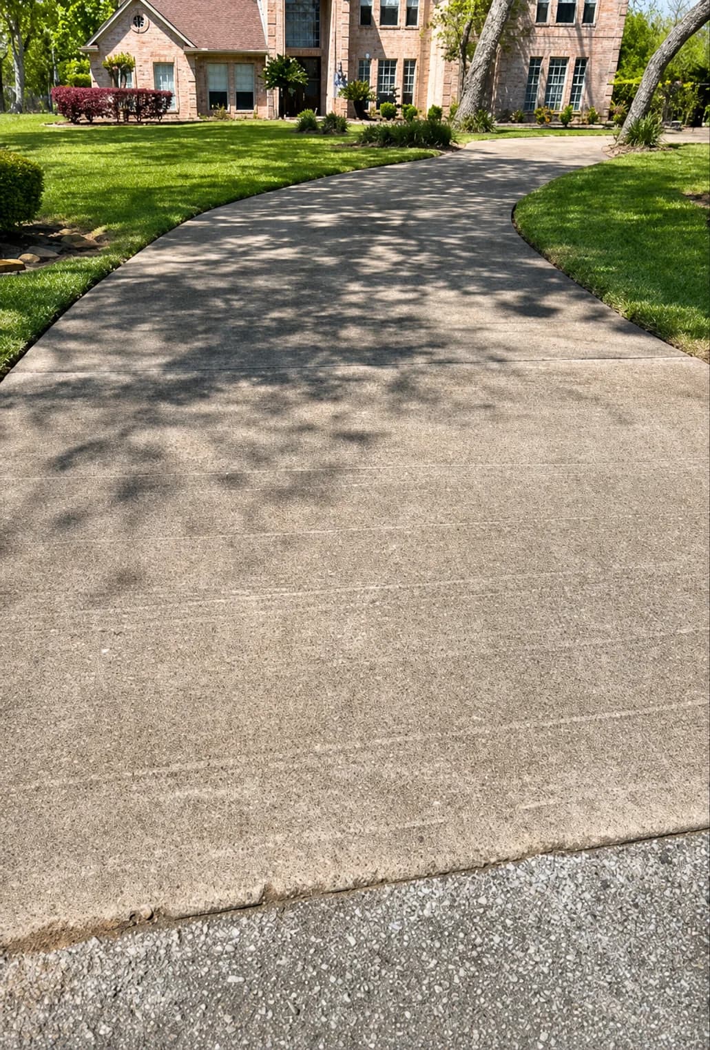 Completed concrete driveway pressure washing project in Houston TX by Operation Clean Freedom