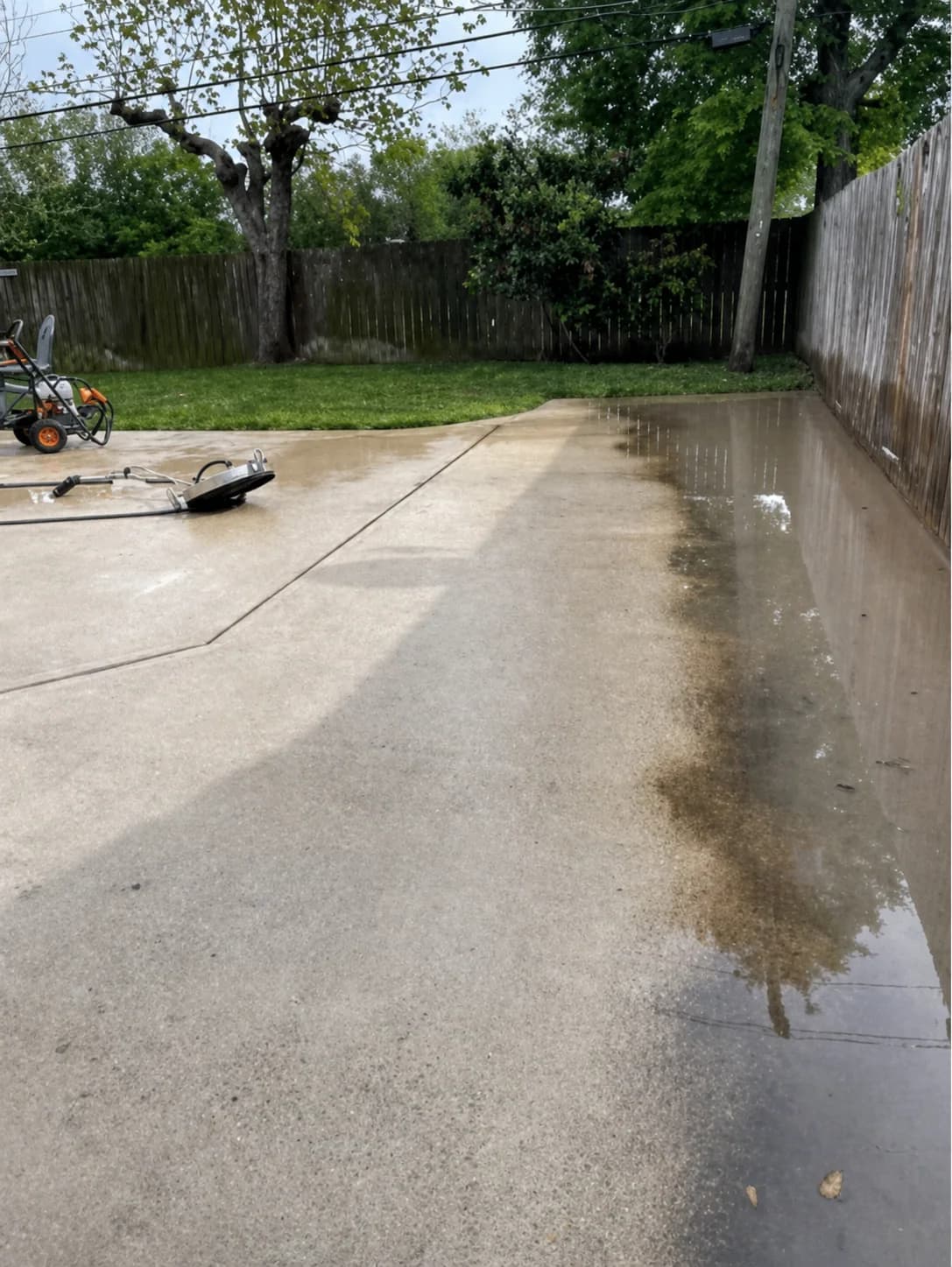 Surface cleaner creating a visible dirty-to-clean transition on a Houston driveway