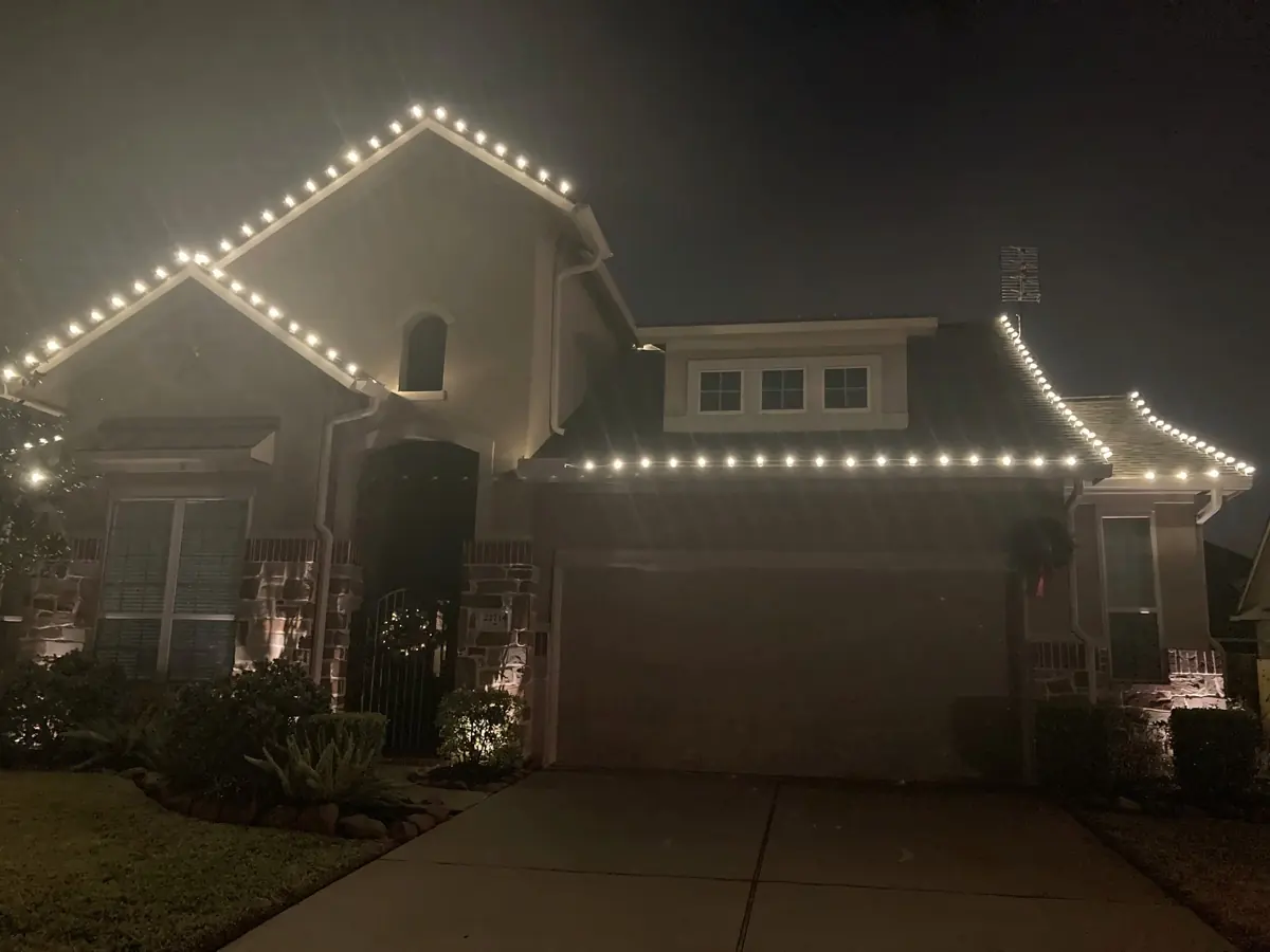 Custom roofline Christmas lights on an OCF customer home